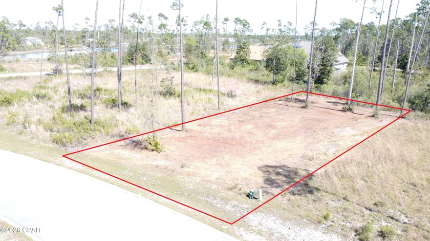 Beautiful Home-site int the desirable Laird Point. This is one of the rare lots that doesn't have any wetlands offering plenty of space to build. On the west side of the peninsula so you get the gentle breezes off the bay.  Laird Point is a gated waterfront community boasting ribbon curbed streets and underground city utilities. Amenities include a tennis court, pickle ball courts and rv/boat storage. Beautiful coastal style homes throughout the community. No pre-set time to build, so you can lock in your spot now, and then build when you are ready. Great proximity to TAFB and Mexico Beach. Full-service marina with boat launch just minutes away. Schedule your visit today!