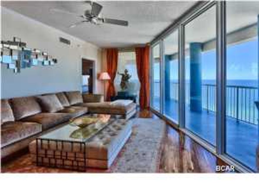 If you are looking for that One-Of-A-Kind luxury condo offering features that are unmatched along the Emerald Coast, then this is the perfect oasis for you to escape to. Unit #1308 is easily the most exquisite unit at Palazzo and is a breathtaking 3BR/3BA West end corner unit. The interior has been nicely upgraded with beautiful & uniquely stained hardwood floors in the living & dining area and all bedrooms! 20'' tile floors are featured in the kitchen, entry, and bathrooms. Enjoy panoramic views of the sugar white sandy beaches and Emerald waters of the Gulf of Mexico from the large wraparound balcony facing West. The floor to ceiling glass throughout the unit maximizes the spectacular views and the glass itself has additional tinting to block UV rays keeping the unit cooler on