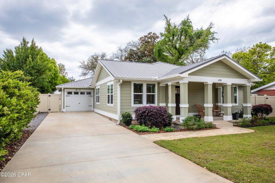 Beautifully renovated Craftsman-style home blending timeless charm with modern upgrades. Originally built in 1945, this home was taken down to the studs in 2022 and thoughtfully expanded to nearly double its original size, while preserving character with original trusses and architectural elements.This 3-bedroom, 2-bath home features an open-concept layout with luxury vinyl plank flooring throughout and a spacious living area perfect for everyday living and entertaining. The chef's kitchen is a standout showcasing quartz countertops, a large center island, stainless steel Signature Series appliances, gas range and decorative hood, farm sink, and abundant cabinetry and with custom pull-out drawers for optimal organization. A picture window above the sink overlooks the private backyard, and a cozy breakfast nook offers the perfect space for gatherings. The primary suite offers ample space, a large walk-in closet with built-in shelving and drawers, and a beautifully designed ensuite bath with double vanity and an oversized, floor-to-ceiling tiled shower. Two additional bedrooms are generously sized and share a full guest bath. Exterior features include two concrete driveways (front and rear) with plenty of room for vehicles, boat, or RV, plus alley access for added convenience.The fully fenced backyard is designed for relaxation and entertaining, featuring a spacious deck, gas fire pit with paver surround, and a lighted pergola ideal for outdoor dining. Additional highlights include a Generac whole-home backup generator, a heated and cooled bonus room perfect for a home office or hobby space, and a private well-fed irrigation system. The meticulously maintained yard showcases mature landscaping, including knockout roses, lush shrubbery, and a beautiful oak tree providing shade and curb appeal. Located in The Cove, a golf cart community within walking distance to restaurants, schools, coffee shops, the Yacht club, and a boat ramp-this home truly offers the best lifestyle and location. Don't miss this one, schedule a showing today! It's a WOW property!