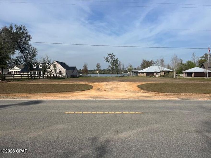 This waterfront property on Williams Bayou, connected to Deer Point Lake, is ready for your dream home. The soil has been cleared, prepped, and seeded, with a wide entrance over a tube and grass-covered slopes. The large, deep lot offers plenty of space to create the perfect waterfront retreat.