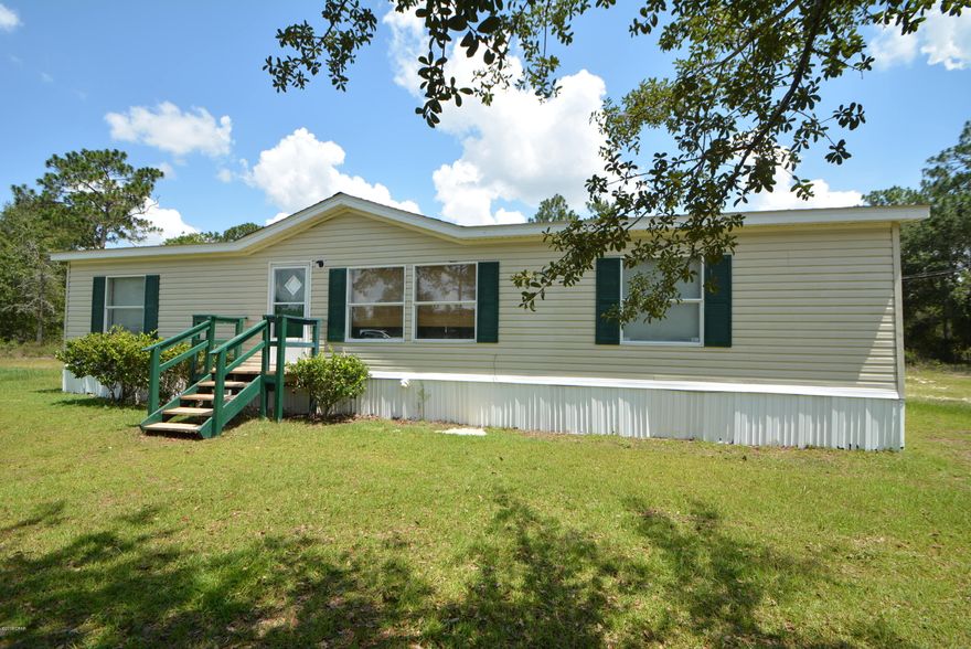 Way more than meets the eye with this fantastic property. This well kept home offers three bedrooms in its split-bedroom plan and two full baths and a NEW ROOF. It sits on over three and a half acres and is fully fenced - bring your horses. As you look at the home, please note that the lot continues well beyond the location of the home and the rear of the lot is beautifully and naturally wooded, a habitat for a variety of wildlife. The floor plan is open and bright. The kitchen has a tiled breakfast bar and includes the refrigerator, dishwasher and oven/stove. The large dining area has a built-in buffet with additional cabinet space. The bedrooms all have spacious walk-in closets. The master bath is quite large and has a garden tub, separate shower, built-in cabinets and double vanities. In the yard there is a 20x30 shed/workshop with electricity, a wooden deck and a child's playhouse. The road is paved, very quiet and the home is within easy walking distance of Deane Bozeman School.