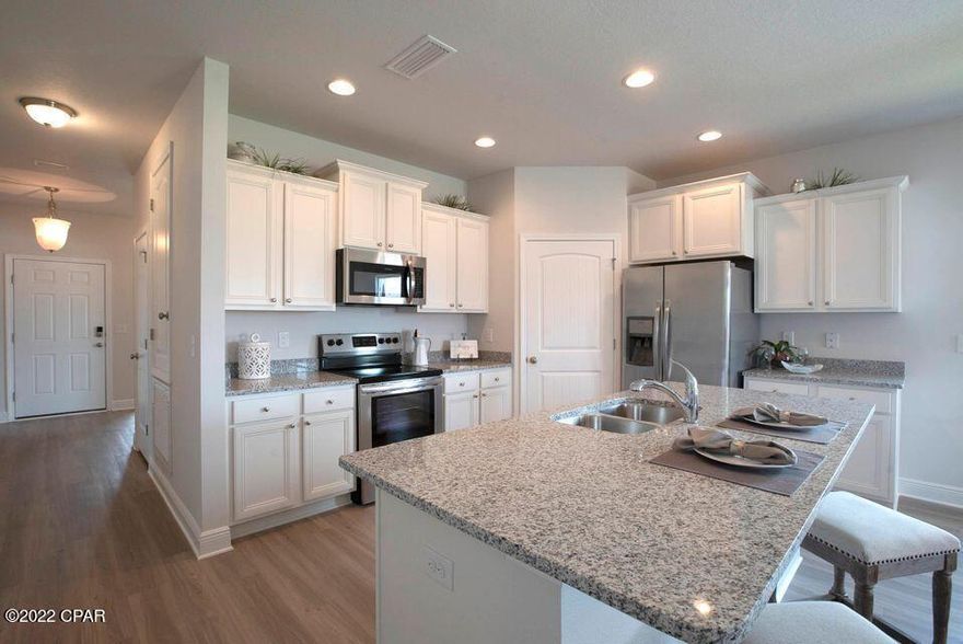 The Kennedy is a charming 4 bed, 3 bath floorplan home located in Windmark Beach overlooking a pond! Interior features of this home include gorgeous granite countertops with undermount sinks in the kitchen and bath rooms. Luxury vinyl plank flooring is throughout the entire home. This home also has Stainless steel appliances including a free-standing smooth top range, microwave, and dishwasher. Windmark Beach is a tranquil community in a natural setting with boardwalks, walking paths, bike trails, roving security and a private beach access. Images, descriptions, SF and room sizes are approximate.