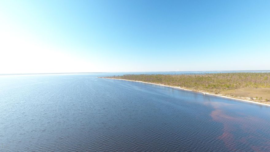 Serene WATERFRONT acreage on the beautiful Eastbay. This property is accessed by paved roads and features the ability to build your dream home along with a deep water access dock. The neighborhood is quiet and private with underground electric in place. Just add your foresight and family.**Recent survey is available.