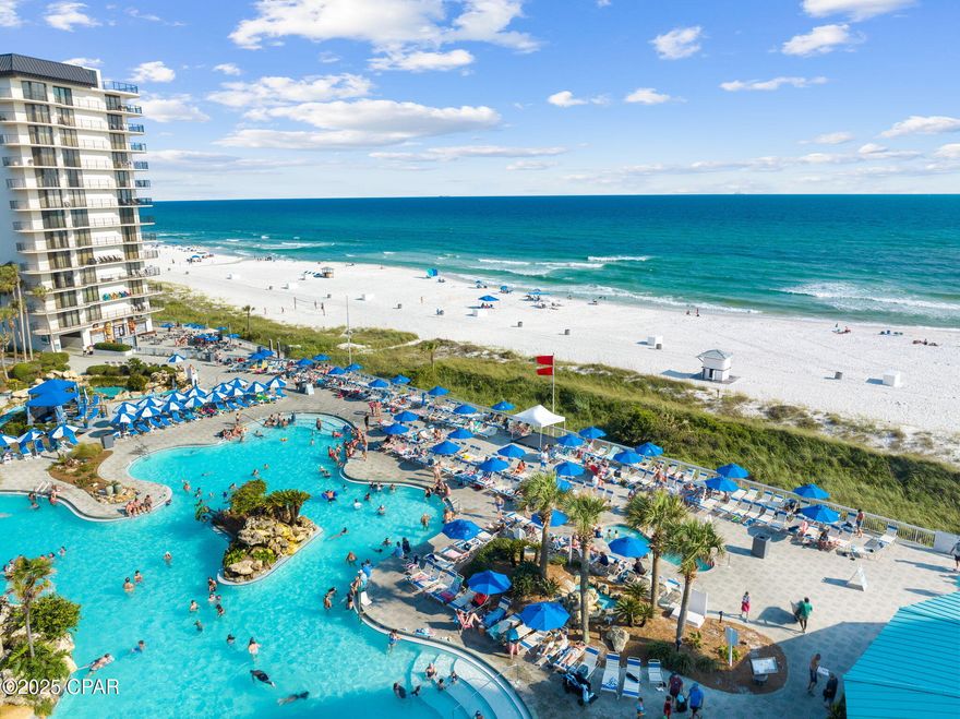Money making machine: over $50k documented GRI in 2024 and over $47k so far in 2025! Welcome to Edgewater Beach Resort #411! This fully furnished 2Bd/ 2Ba Gulf Front Condo spans over 1,317 SqFt perfect for full-time living, a vacation home, or as investment property. This unit boasts some amazing features, like an open floor plan, breathtaking Gulf views from the balcony, the living/dining area, kitchen, as well as spectacular views from one of the master suites. The floor plan is a must-see! One master suite features sliding doors that lead to the balcony for you to take in those infamous PCB sunsets! If you'd rather enjoy the scenery from indoors - the floor to ceiling windows in the master suite will be perfect for you! 

Edgewater Beach Resort is secure, gated community offering an unparalleled lineup of amenities, including a private beach, 11 swimming pools (10 heated in cooler months and an expansive 11,500-square-foot lagoon-style pool with waterfalls and cabana rentals), four Gulf-facing hot tubs, a kids' splash pad, an executive par-3 golf course, 10 tennis courts, 5 pickle-ball courts, 10 shuffleboard courts, a basketball court, a complete fitness center, on-site restaurants dining, as well as EV-charging stations, trailer/boat/RV parking, and a convenient tram system. Just across the street, you'll find top-rated dining at Firefly, pampering at Bella Day Spa, and family fun at Rock'It Lanes bowling and arcade. Call now to schedule your private and exclusive tour!