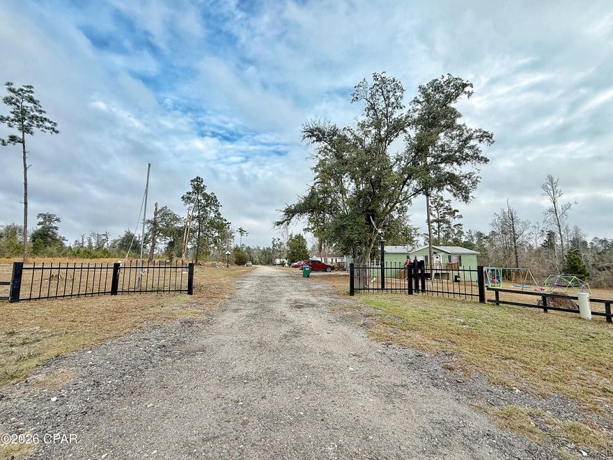 Rare opportunity to own a growing mobile home park in a highly desirable location just east of Marianna, Florida. This well-situated GATED park currently features 4 income-producing units—2 double-wide homes and 2 single-wide homes—all positioned on a private lake, offering a peaceful setting that enhances long-term tenant appeal.

The property includes 15 additional approved lots ready for future homes to be brought in, creating substantial upside for increased cash flow. All lots are equipped with underground utilities, public water, and public sewer, significantly reducing development costs and simplifying expansion.

The park currently generates $4,575 per month in gross income, with strong potential to grow revenue through infill development. Located in a great area just east of Marianna, this property offers convenient access to town while maintaining a quiet, attractive environment.

Ideal for investors seeking immediate income with long-term value-add potential in a stable North Florida​​‌​​​​‌​‌​​​​‌​​‌​​​​‌‌ market.