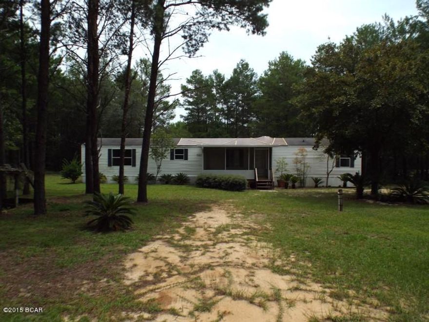 Three Bedroom Two bathroom single wide mobile home on a 3.1 acre lot offered as is.  All sizes approximate or taken from other sources please verify accordingly.