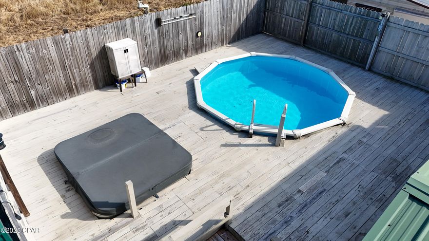 CURRENTLY UNDER CONTRACT, SELLER WILL CONSIDER BACKUP OFFERS' Charming & Affordable Home in the City
This well-maintained home is a fantastic find for budget-conscious buyers who need a little extra space. Featuring a large master bedroom with a walk-in closet, this home offers both comfort and functionality.  
Key highlights include:  
Metal roof,  for durability.  Carport 18x21 & fenced yard, for privacy and convenience.  Covered porch, to relax and unwind.  Above-ground pool & hot tub, with built-in decking—perfect for entertaining.  Hurricane shutters (2019)for added protection.  Whole-house generator, for peace of mind and a whole house air flitter for better air quality. Additional storage sheds, 12x10 and 12x8 both with electricity, for all your extras  
Nestled on a quiet street, this home is just minutes from shopping, schools, entertainment, and Tyndall AFB.The spacious yet manageable lot is ideal for weekend gatherings. Don't miss out on this incredible opportunity—schedule your showing today!