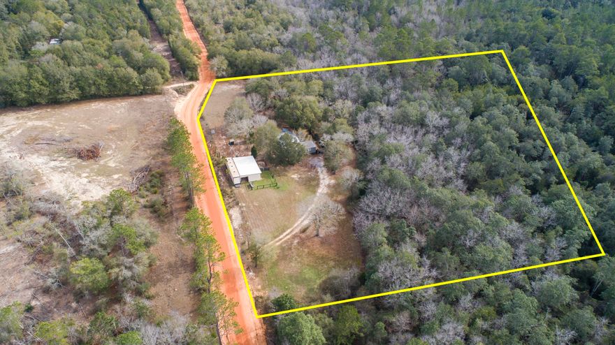 ACTIVE-CONTINGENT / ACCEPTING BACKUP OFFERS!

Absolutely stunning and rare retreat located approximately two miles north of Defuniak Springs. This amazing two-bedroom, two-bathroom home is situated on 10+/- acres and has been expertly renovated with custom craftsman finishes, and has never been lived in. Many of the finishes of this home includes high-end luxury vinyl plank flooring, new windows, new exterior siding, new interior paint, and new exterior decking. The kitchen features new shaker style cabinets with ample storage space, leathered granite countertops, and new stainless-steel appliances. Homes of this magnitude exude all of the features desired by the most discerning buyer including new interior sliding rail barn doors for ultimate privacy and all new high-end fixtures, custom lighting, and the most premium Samsung washer and dryer (convey). The guest bath features a tiled tub while master bath features zero entry fully tiled shower with double shower head, and custom vanity.
This home sits on 10+/- acres, and the lot oversees Juniper Creek where you can cross the creek on the edge of the property. Matter of fact, Juniper Creek is visible from the living room, dining area, and porch.
This property has a large pole barn with stalls for horses, tons of woods, trails, and pastures, so it's perfect for horses or hunting (this acreage is full of deer and turkey).
Cross the creek on the foot bridges, wander this amazing property, and you will never want to leave! This is a very unique property located so close to town, Eglin AFB and the beautiful beaches of South Walton. You've got to see this one to believe it!