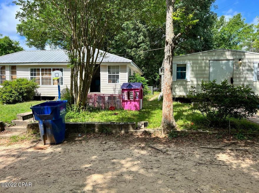 This home is a 3/ 2,  situated on a quiet corner lot. Home has a new well and a newer roof. Home has a 24x24 pole barn and 10x12 utility shed. Property also has a 20x20 shed that has been turned into a one bedroom apartment.