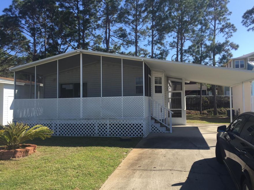 Here is an awesome opportunity to own in Greenwood Acres, Panama City Beach.  This is a 55+ community, with pool and lawn care included.  The home has 2 screened porches, 2 bedrooms, 2 baths and a large living area that opens to the front screened porch.  This particular home is located right next door to the pool (and the pool is typically very quiet) so you'll enjoy the convenience for exercise and cooling off on those hot August days! Association fees are low, keeping your ownership costs lowest of any beach area. (all info in the listing is approx and anything that is important to buyer should be verified.)