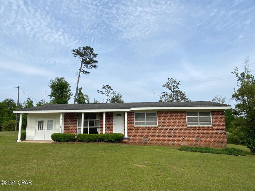 CURRENTLY UNDER CONTRACT, SELLER ACCEPTING BACKUP OFFERS.  Well maintained 3 bedroom, 2 bath brick home on 2.22 acres!  This home has beautiful original hardwood floors and new ceramic tile in the kitchen, den & playroom.  The kitchen has lots of cabinets & counter space and a breakfast bar!  The living room is light and airy with a large window.  There's a nice size den with french doors.  Plus a bonus room that was used as their grandchildren's play room.  Enjoy your time outdoors in the huge screened porch!  This home is conveniently located close to Chipola College and Jackson Hospital.  Call today to see this home.