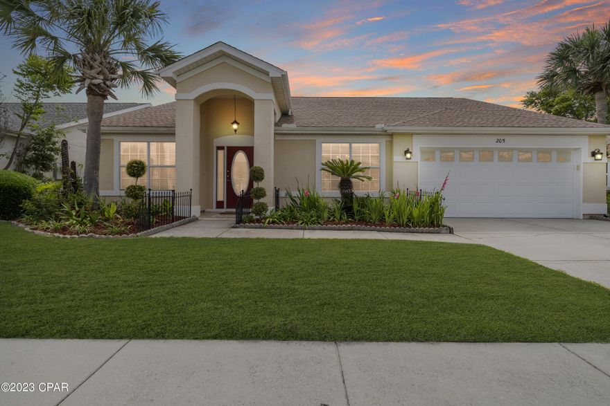 Nestled in the Summerwood neighborhood, this spacious 4 bedroom, 2 1/2 bath home is located just half a mile to Pier Park and within 3 blocks to the Award Winning white sandy beaches & beautiful turquoise waters. Beautiful curb appeal. The home features a dining room, open concept kitchen to family room, large main bedroom with an en-suite, split floor plan, vaulted ceilings, crown moldings throughout, engineered hardwood, tile, and new french doors that lead to a screened in back porch for sunset views. The large back yard is fully fenced in. This home is one you don't want to miss!