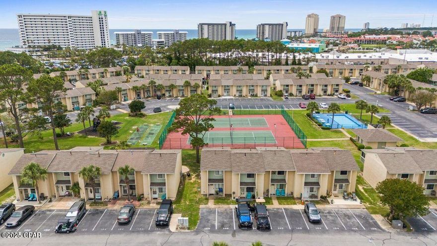 Welcome to Gulf Highlands Beach Resort in beautiful Panama City Beach, Florida. FABULOUS LOCATION! This townhome backs up to one of the common areas, meaning you will not have another row of units behind you! Walk out the back door to a pool, tennis court, pickleball court, and playground! Short stroll down the sidewalk to the world's most beautiful beaches! For this reason, this unit is very desirable to renters. Let your annual rental income help pay for your slice of paradise! Projected income is $35K and higher. Park directly in front of your unit with no elevators to maneuver. Amenities include a beachside restaurant and pool, 11 swimming pools (5 heated), 3 tennis courts, pickleball, fitness center, 18 hole mini-golf, 2 playgrounds, shuffleboard, and conference center. Numerous entertainment options are available within walking or golf cart distance, including Rock'it Lanes Bowling/Skating/Arcade, Just Jump Trampoline Park, Shipwreck Island Water Park, Ripley's Believe it or Not, Wonder Works, fishing pier, shops, restaurants, bars, and more. This secure, golf cart-friendly resort offers an ideal environment for short-term renters and full-time residents alike. The relatively low HOA fees cover various amenities, including trash, internet, landscaping, pool servicing, and termite & pest control. At Gulf Highlands Beach Resort, every season is Beach Season! Age, Sq Ft, and dimensions approximate.