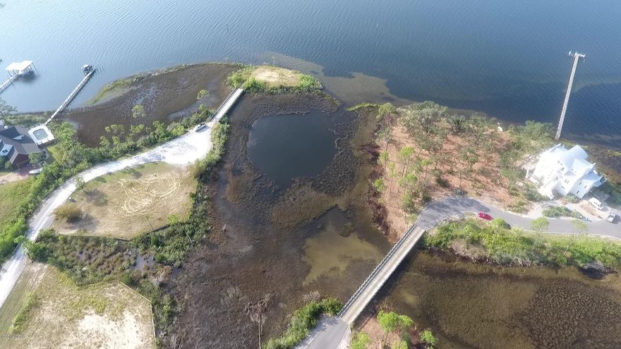 Bayfront! Lot 8, Northshore Islands Road, a private island, buildable lot with spectacular views and boatable waterfront! Experience sunrises, dolphin, wildlife, nature and a different sunset everyday all your own! There are only 12 total lots and half are already Sold, come visit today!