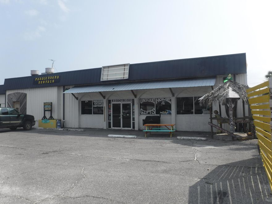 Looking to own a business on Panama City Beach ? Well this is it. This is 2800sq feet retail space located on the Thomas Dr corridor. This space would a great retail Surf and t-shirt spot. New A/C, handicap restrooms, office, plenty of parking This space also could be a restaurant. It has a 22'x 10' kitchen with a hood system in place. Your only limitation is your imagination. Call listing agent for a showing.