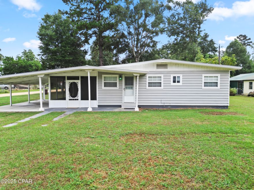 Welcome to this fully furnished 2 bedroom 1 bath country home nestled in a small community right along the Chipola River.  Located on a corner lot, this adorable home has a screened in porch along with a covered carport with new concrete flooring.  There are also two large storage sheds, one with electricity, which will convey with the home.  The inside features newer stainless steel appliances with tile backsplash and beautiful real wood floors!  The utility room is over sized for additional storage and includes a top of the line water filtration system.  This location not only offers a boat ramp for the residents of this community, but some of the world's most beautiful beaches are only a 40 minute drive away!  A new hospital is located only minutes away.  Don't let the opportunity for quiet country living in this adorable home pass you by!