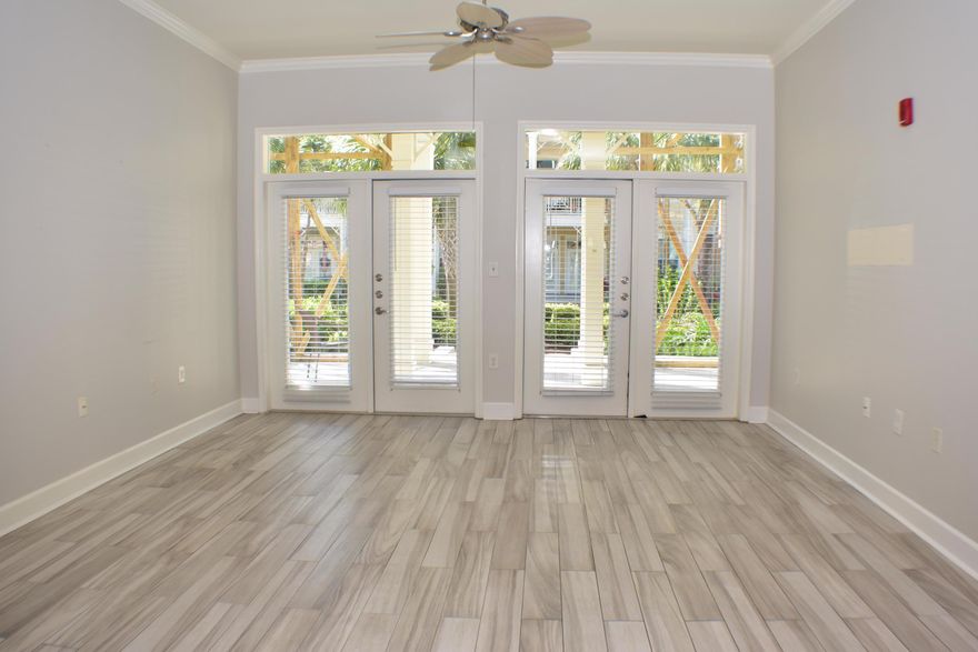 CURRENTLY UNDER CONTRACT, SELLER ACCEPTING BACKUP OFFERS Fantastic ground-floor Island Reserve unit now available!  This 2BR/2.5BA condo has brand new porcelain tile floors, new carpet in one bedroom, stainless steel appliances, granite counters in the kitchen & baths, walk-in closets in both baths, & French doors that open to the large covered patio.  Speaking of the patio, it overlooks a beautiful courtyard with park benches, colorful planters and fountains, and gravel and brick pathways that lead to the lagoon style pool with waterfall and the community room/fitness center.  There is also covered parking for the residents!   Island Reserve is a gated community just 5 minutes from the Navy base, the beaches, shopping centers, restaurants and more!  All info is approx and must b