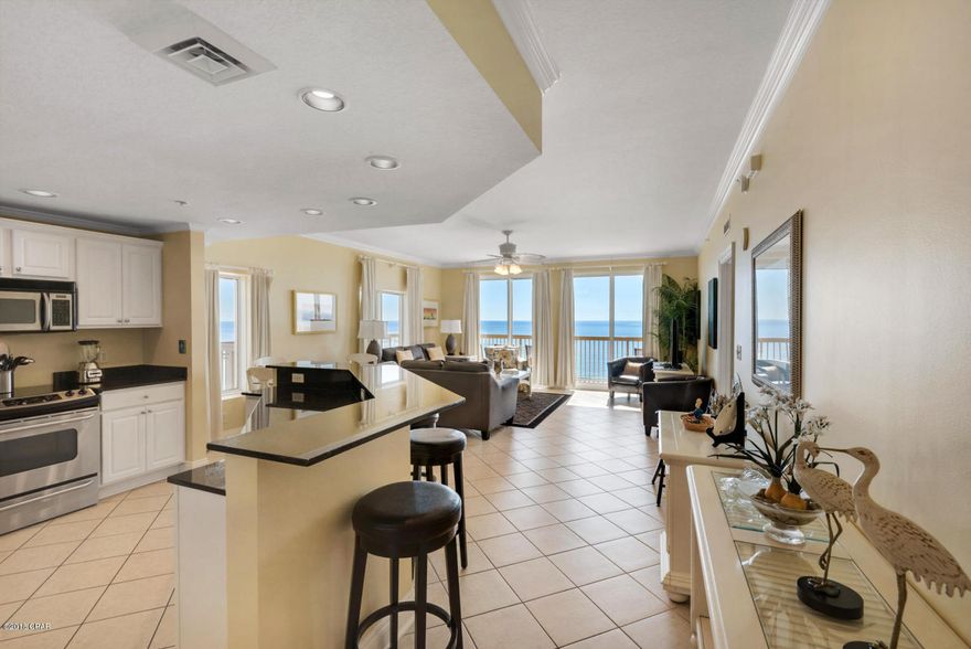 **END UNIT** **FANTASTIC CONDITION** This 2BR/2BA end unit features a large wrap-around balcony, tile throughout and stainless steel appliances. The furniture package is far from the ordinary condo package...beautiful pieces decorated with a coastal flair