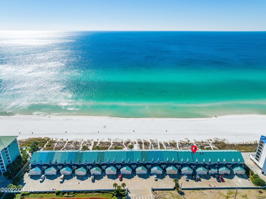 CURRENTLY UNDER CONTRACT, SELLER WILL CONSIDER BACKUP OFFERS Move right in and start enjoying all that peaceful coastal living has to offer. This is impressive an amazing gulf-front townhome with 2 bedrooms and 3 bathrooms and loads of character. You will notice the breathtaking panoramic views from the moment you enter. With vaulted ceilings paired with the open floor plan it was clearly designed to keep all of nature's elements in sight. Enjoy brilliant sunrises as well as exceptional dolphin spotting from the 180-degree open water views of the Emerald Coastline. Recent upgrades include: New storm windows 4/22, downstairs flooring 11/21, and AC unit 12/20. The inviting family room which looks out onto the water is adjacent to the kitchen and provides the perfect space for seamless entertaining. The kitchen is large and spacious. A gorgeous tile shower/tub combo, large vanity & custom walk-in closet complete the owner's suite. Celebrate paradise-living with your own large private deck and deeded beach access right outside your living room. This home comes fully furnished... rental or move-in ready. 

With new windows and many other renovations, Unit 7 would make an excellent rental property or an amazing beach home. Ideal location central to 30A and Pier park. ** All information to be verified by buyer.