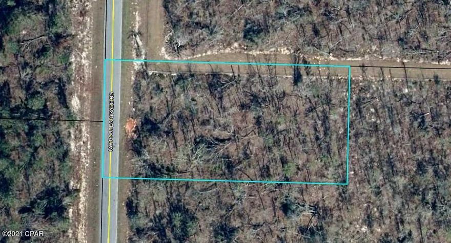 1 acre located on a paved road.  45 minutes South  to Panama City to Beaches. 30 minutes to Walmart in Marianna.