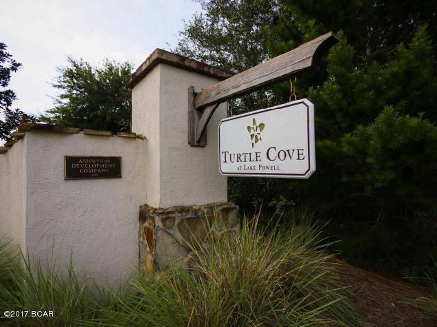 Welcome to Turtle Cove! Located on Lake Powell which is on the quiet West End of Panama City Beach and tucked away from the main road, this wonderful community has a fantastic Lake House featuring a full gym with elevator access and lake views, a lakefront pool, hot tub and fishing/boat dock. Two wonderfully kept tennis courts and an open, landscaped green space allows you to enjoy this active community all year round! There are only a few lots to build a custom home on and this one is across the street from the Lake House! Builder Plans are available. This lot will fit approx 2600sqft under the roof, 2 story 4 bedroom home,  with a bonus room, decks on the first and second floors (or a smaller home). The beach, 30A and Pier Park are only minutes away! Call for codes to the amenities.