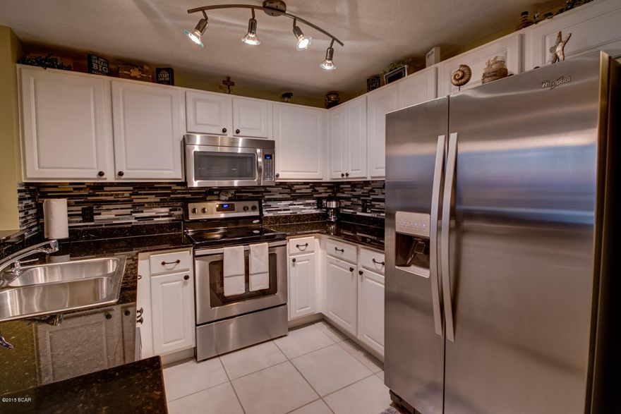 Newly Renovated, highly desirable Calypso East Tower 17th floor unit with well-established rental history. This condo has been updated in October 2015 with new stainless appliances, kitchen back-splash, new water heater, new living room furniture, new decorations and new paint. One of the most popular floor plans at Calypso, this 2 bed, 2 bath unit also features an additional bunk room for maximum occupancy. This pristine unit boasts spectacular sunset views over the Gulf from your private balcony, tile floors throughout, granite countertops in the kitchen and bathrooms. Escape to the spacious master suite featuring a walk-in closet, private en-suite bath with double sink vanity, and access to the unit's private balcony.