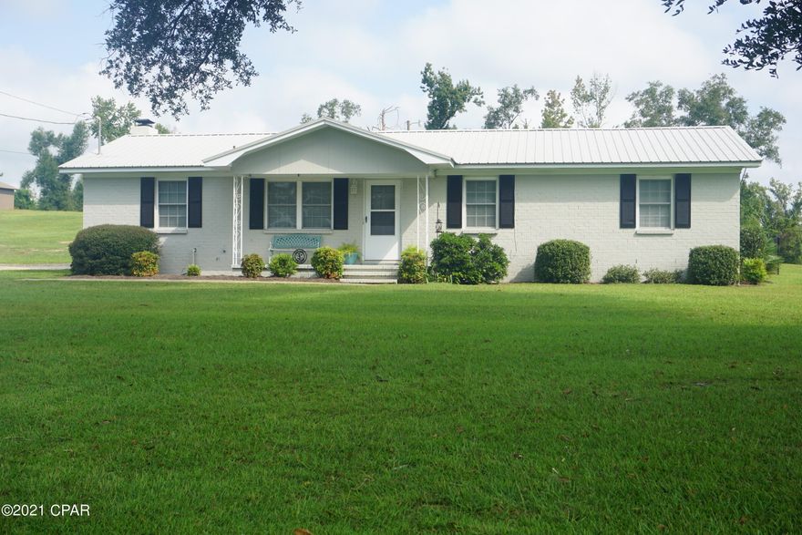 Beautiful home that sits on one of the larger lots in Dogwood Heights Subdivision. This is a really cute home that features two living room spaces that are both open to the kitchen with one including a wood burning fireplace.  It also features a large kitchen with an eat-in area, three nice sized bedrooms with one including its own 1/2 bath. The outdoor areas on this property are really pretty. The yard has lush grass across the entire property and also has a satsuma tree covered in fruit. Walk out back onto your screened in back porch. There is a chain-link back yard pet area with a nice gazebo cooking/relaxing area. Walk up the steps to enjoy the gorgeous private pool area that has a large sun deck section for laying out on lounge chairs.  This home is just waiting on its new family.