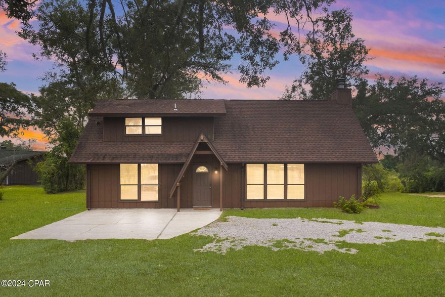 Welcome to your dream retreat with access to Deerpoint Lake! This home offers a perfect blend of rustic charm and modern amenities, making it the ideal sanctuary for relaxation and recreation.

Featuring a private downsairs bedroom and a spacious loft/bedroom upstairs, this home provides ample space for comfort and leisure. A charming Florida room leads to a large deck overlooking the water, perfect for enjoying your morning coffee or hosting gatherings with friends and family. Enjoy direct canal access with your own private dock and boat launch, making it a breeze to partake in water activities and soak in picturesque sunsets. The property has a detached garage/shop, ideal for storing your toys or pursuing hobbies.

Nestled amidst nature, this tranquil haven promises peace and privacy while being conveniently located near essential amenities. You'll be just a short drive away from stunning beaches, offering endless opportunities for sun, sand, and fun. The nearby airport ensures easy access to travel, while a variety of shopping and dining options are within close reach, catering to all your needs.

Whether you're seeking a weekend getaway or a year-round residence, this delightful cabin on Deer Point Lake is a rare gem waiting for you to call it home. Don't miss out on this unique opportunity. Schedule your private showing today and experience the charm and tranquility of this beautiful lakefront property. If important, please verify all measurements.