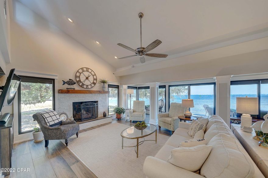 Welcome to your absolutely gorgeous bay front property, complete with DEEP WATER boat slip and garage! Enjoy single story living, the corner unit, and beautiful views from almost every room.  Expansive deck along the entire back of your property with room to grill, entertain, warm by the fire pit, or just sit and relax and take in the sunshine and the captivating view. Interior of home is completely redone to custom perfection. 

 Boat slip has a brand new 6000 lb lift.  New dock right behind your property - enjoy fishing, relaxing on the deck, or take your water toys out to play. (shared dock with next door neighbor) Your open floor plan has a wonderful flow for easy living in coastal elegance.  Fireplace has new gas logs, outdoor grill and fire pit have natural gas. Call today!