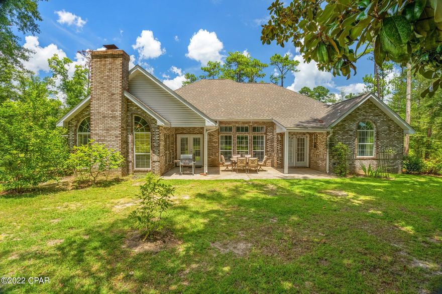 You will fall in love with this beautiful brick home in a gorgeous country setting in Chipley!  This home was custom built with 4 bedrooms and 3 baths and a great floor plan.  Extra features of the interior include 10 foot ceilings throughout, two living areas with the spacious living room, and a den with wood burning fireplace.  If you love to entertain there is a separate dining room with built ins; or this area makes a convenient study if you work at home.  The chef in you will love the kitchen with newer appliances, ample storage and a breakfast nook. The primary suite has access to the back porch with double French doors and a full bath with soaking tub, separate shower, double vanities and a spacious walk in closet.  The outdoor country setting will wow you with a lemon tree, 3 kumquat trees, a fig tree, peach tree, apple tree, grapes and rosemary!  Need room for extra storage or an extra vehicle, or a work out area? We have you covered with a three bay detached garage in the back of the property.  Current sellers have a gym set up in a third of the outbuilding.  There are so many possibilities with this detached space.  Good news on the roof! It was just installed in June of 2020!  You will not run out of hot water with two different hot water heaters!  Call your favorite Realtor for an appointment today!