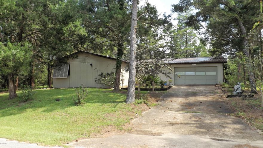 You wont find another home like this! Fantastic curb appeal. A well cared for home with 3 bedrooms and 2.5 baths. Seller has put on a new metal roof and updated flooring with wood tile floors. Living area and dining area are large and open to a heated and cooled Florida room. A sauna is located just off the master bedroom with a shower to cool off after each session. A Cuddy Vac system installed in the home, convenient for each room with one hose and retracts after use. A nice concrete patio opens to a large yard with fire pit, great for entertaining family and friends or just relaxing. 2 car garage has plenty of room for storage. You will love the Sunny Hills community with many amenities, to name just a few, a public 18 hole golf course and many lakes for fishing and exploring.