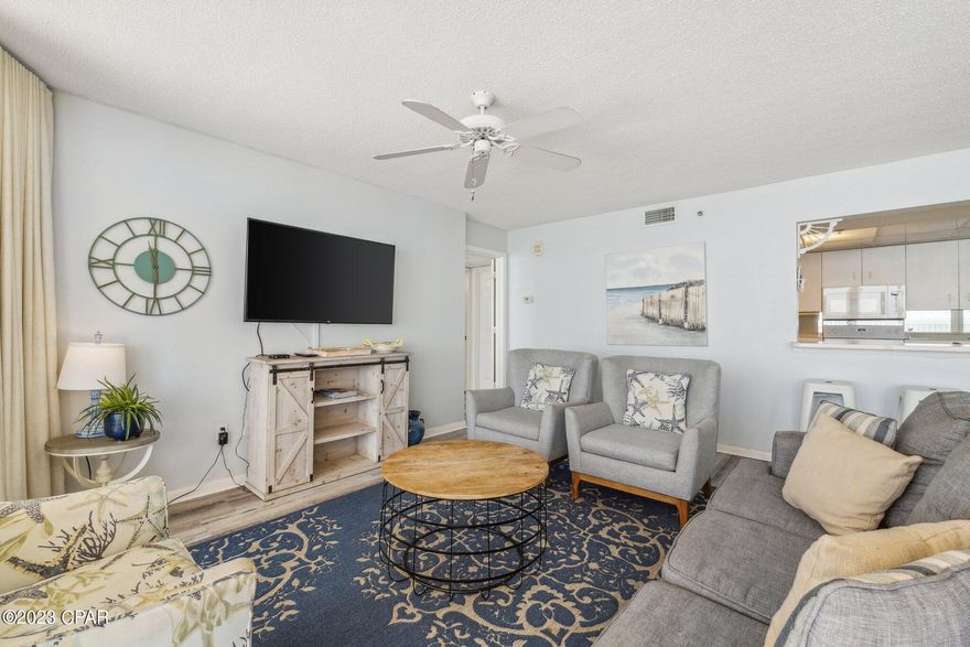 This beautiful Long Beach 2 bed 2 bath condo offers stunning gulf front views from both bedrooms, living room, dining room and kitchen due to floor to ceiling windows! Enjoy the spacious feel in the unit and the incredible balcony where you have enough room for outdoor dining and extra seating.  The amenities at Long Beach are fabulous.  There are two heated Polynesian pools with hot tubs that have a view of the beach and a Grand Lagoon 6800 gallon pool that has waterfalls and palm tree islands.  For poolside refreshments there is the ''Hang Out' bar and grill with delicious meal options and tropical drinks. Beach chair service is offered along with paddle board and jet ski rentals and parasailing trips.  There is an exercise room with treadmills and elliptical machines. Parking is out in front of your building and the parking lot is gated with 24 hour security.  Long Beach offers 1300 ft of beach frontage for your enjoyment.  There is a Wal Mart and several restaurants including Pineapple Willy's, The Wharf and Dirty Dicks Crab House within walking distance along with great attractions such as Wonder Works, Ripley's Believe it or Not, Signal Hill Golf Course and Coconut Creek Family Fun Park.  In addition, it's only a short drive to the shops at Pier Park or St. Andrews State Park.  The unit is a very busy vacation rental that can sleep 8 and rents by the week.  2023 gross rental income was $56,000. Make plans to view this unit today!  As a bonus, the seller will pay the balance of the Condo Fee's for 2024 at closing.