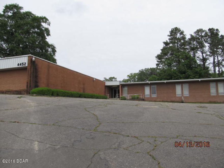 LARGE OFFICE SPACE with Reception Areas, Conference Space, Separate Offices already in place.  Building has been updated but needs a little TLC for your business.  TWO Parking lots with plenty of parking space.  Two Front Entrances and One Back Entrance.  Road frontage on Front and Back.  PRICED TO SELL.  CONSIDER MAKING AN OFFER on this building LISTED for $250,000, below market value.