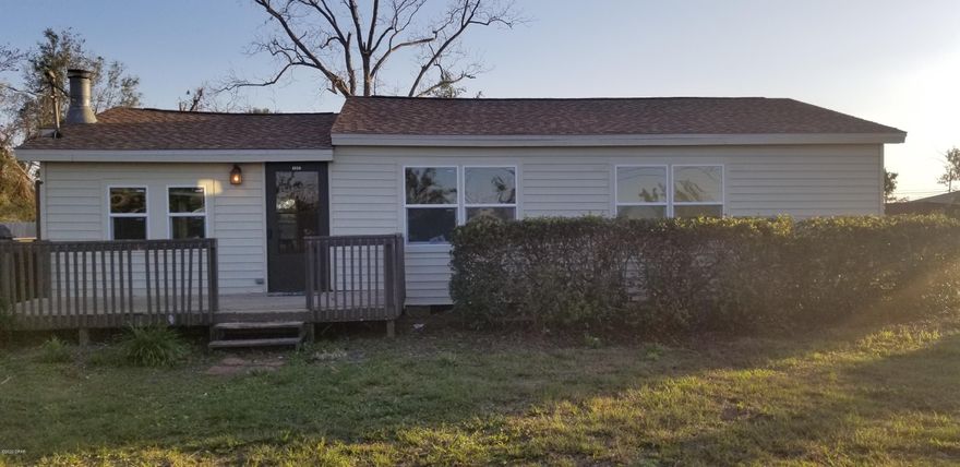 Move in ready house sitting on just over half acre lot, close to town. House has been completely repaired from light hurricane damage. New roof, windows, flooring and paint. House has 3 large bedrooms, spacious great room with wood burning fireplace and large kitchen.  New storage shed that houses well and pump.