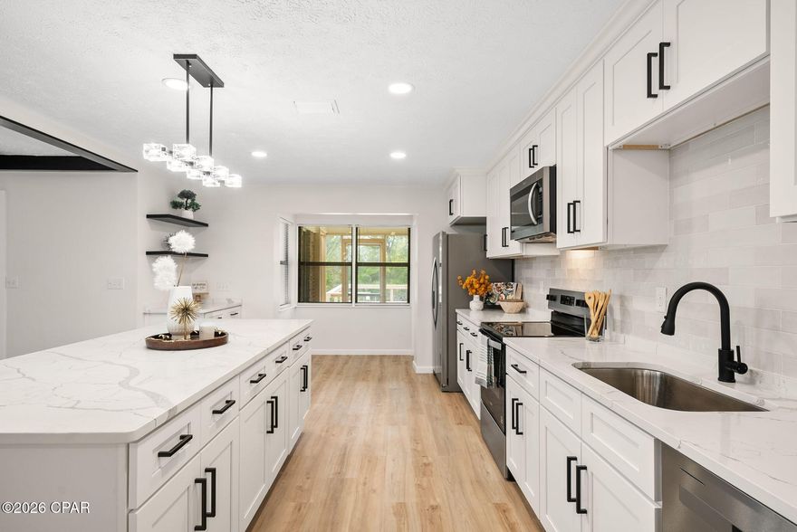 Welcome to this stunning 3 bedroom, 2 bath home located in Lynn Haven! This charming brick residence offers timeless style, excellent craftsmanship, and truly great bones--ideal for buyers seeking quality, comfort, and convenience all in one place.
Step inside to find a spacious living room with beautiful exposed beams and an inviting atmosphere perfect for relaxing or entertaining. The brand new kitchen is a true showstopper, featuring all-new appliances, brand new cabinets, modern fixtures, and beautiful new flooring that flows throughout the home. Both bathrooms have also been fully updated, offering fresh, modern finishes and thoughtful design.
Just off the main living area, you'll find a beautiful sunroom filled with natural light, complete with built-in bookcases and cabinets, making it the perfect space for hobbies, reading, crafting, or a peaceful home office.
Outdoor living is just as enjoyable with a screened-in porch and a deck overlooking the canal--ideal for morning coffee, evening relaxation, or entertaining guests.
The two-car garage offers abundant storage and workspace, perfect for vehicles, hobbies, or equipment. There is also additional parking available for extra vehicles or even a boat.
Situated in a quiet, well-established neighborhood and centrally located, this home combines charm, quality upgrades, and an unbeatable location.
Don't miss this opportunity--homes like this don't come around often!