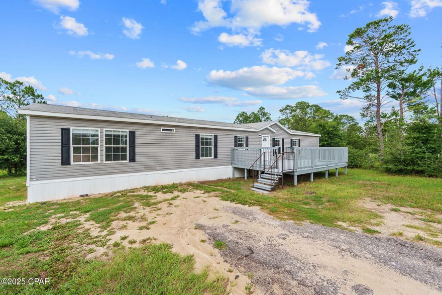 ***PRICE IMPROVED ON THIS 100% FINANCING ELIGIBLE PROPERTY!! ***

Don't miss this opportunity to own this beautifully updated 5-bedroom, 2-bathroom home offering 2,280 square feet of living space on nearly a full acre in peaceful Southport. Built in 2017 and recently upgraded from top to bottom, this home seamlessly combines modern finishes with ample space to spread out, both inside and out.

Just off the foyer, you'll find a built-in office or homework station designed to bring function and convenience to a home of this size. Whether you need a quiet spot for remote work, a place for kids to focus on schoolwork, or a central hub for household organization, this dedicated workspace adds incredible value without sacrificing bedroom or living space.

The spacious split floor plan offers maximum privacy with a large open-concept living area and a separate family room or den measuring approximately 18.5 feet by 15 feet. This additional living space is perfect for a playroom, media room, home office, or second entertaining area, offering endless versatility to suit your lifestyle.

Recent improvements throughout the home include all-new vinyl plank flooring in the main living areas and plush carpet in the bedrooms. Fresh paint and new textured walls give the home a crisp, modern feel. Crown molding has been added throughout the main living areas, elevating the home's overall design. Every room features new light fixtures, ceiling fans, and window blinds for a polished and cohesive look. All cabinetry has been professionally painted and upgraded with sleek new hardware, adding a fresh designer touch throughout.

The kitchen has been thoughtfully updated with brand new lower cabinets, granite countertops, a deep stainless steel sink, a modern pull-down faucet, and new stainless steel appliances, making it as functional as it is beautiful.

The primary bedroom is a private retreat, featuring a large en-suite bathroom complete with a soaking tub, double vanity, separate walk-in shower, and an oversized walk-in closet measuring approximately 7 feet by 7 feet. The guest bathroom features a transom window, providing both natural light and added privacy. Both bathrooms have been updated with brand new toilets, giving them a fresh and modern feel.

Additional upgrades include a new HVAC system and a new thermostat, ensuring energy efficiency and year-round comfort. Outside, the front porch has been rebuilt and freshly painted for long-lasting curb appeal and protection from the elements. The spacious backyard is partially fenced and features mature landscaping, including a fruit-bearing tangerine tree, making it ideal for outdoor entertaining, gardening, or play.

Located in the desirable Bozeman School Zone and just a short drive to schools, shopping, dining, and North Bay access, this move-in-ready property offers the best of quiet country living with modern conveniences. With all the big-ticket updates already completed, all that's left to do is move in and make it your own.

Schedule your private tour today with a REALTOR® and see everything this exceptional home has to offer. If necessary, please verify all measurements.
