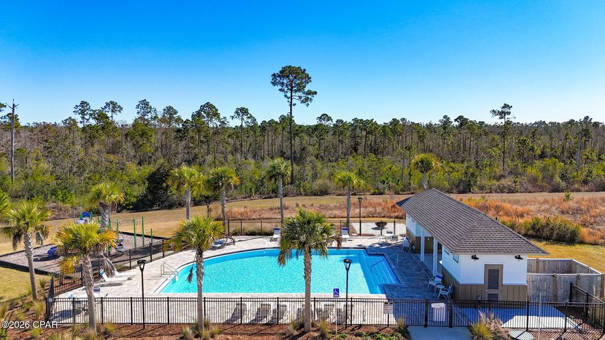 Reduced nearly 5k...this beauty is only 2 yrs. old.  Priced to sell, don't let this one get away!!  Located in Park Place in Panama City FL, this 4-bedroom, 2-bath Freeport floorplan offers 1,387 square feet of well-designed living space in one of the closest new construction communities to Tyndall Air Force Base. The welcoming entry opens into a bright, open-concept layout ideal for everyday living and entertaining.

The kitchen features a large center island and granite countertops throughout the home, with clear sightlines to the dining and living areas. A split-bedroom design provides privacy, with two bedrooms and a full bathroom at the front of the home and an additional bedroom off the entry hallway.

Main living areas, bathrooms, and laundry room are finished with luxury vinyl plank flooring, while the bedrooms feature carpeting. The primary suite includes a spacious bedroom and an en-suite bathroom with a double vanity, oversized shower, and large walk-in closet.

Exterior features include a brand-new privacy fence with integrated LED lighting and a backyard with ample space. Residents enjoy access to a beautiful community pool maintained by the low cost HOA. Conveniently located near shopping, parks, and schools, with easy access to Tyndall Air Force Base. Low HOA fees, billed quarterly, add to the home's overall value.

Schedule your private showing today and see why this home is the perfect place to make your next move.