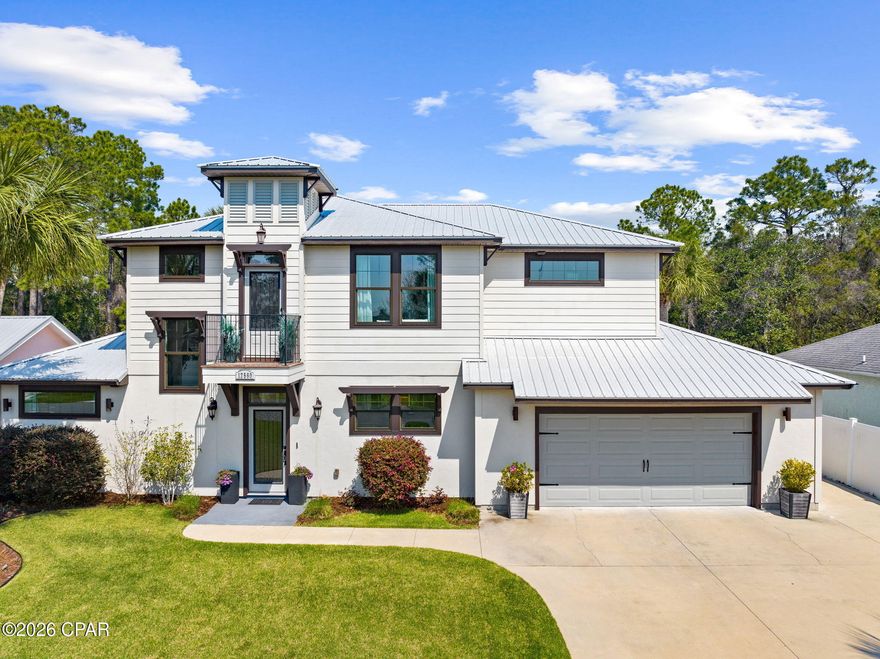 Builder's Personal Custom built Luxury Home on a natural Lake in this Prime Panama City Beach Location! This stunning home is situated on a cul-de-sac and offers the perfect blend of privacy, elegance, and convenience--just two blocks from the World's Most beautiful beaches in Panama City Beach and moments from Pier Park dining and shopping, Top Golf, the new Dolly Parton Pirates Voyage dinner shows, and convenient to some of the beaches top-rated schools. Built in 2020 to the highest hurricane standards with upgraded doors and windows, this home has been thoughtfully designed inside and out. Step inside to find luxury vinyl plank flooring, shiplap accents in every primary room, and an inviting open-concept floorplan that flows seamlessly from the living room to the dining area and into the chef's kitchen. The kitchen is a showstopper, featuring quartz countertops, beautiful backsplash,a stainless steel appliances with dual oven electric stove, a pot filler, top-of-the-line slide-out microwave drawer, and soft-close shaker cabinets--perfect for entertaining or everyday living. Enjoy year-round comfort with a Rinnai tankless water heater providing endless hot water, plus hot and cold exterior faucets for convenience. The cozy enclosed patio room is used as an extra den and is the perfect spot for relaxing and overlooking the private natural lake, creating a peaceful setting for morning coffee or evening gatherings. This home offers flexibility with a bonus room/office on the main floor and an upstairs loft that can easily serve as a second office, media area, or playroom. The oversized garage is extra deep and includes a third golf cart door, ceiling fans, and additional golf cart parking alongside the home--ideal for a small boat. 
The Additional highlights include: Private cul-de-sac location on a secluded lake Enclosed sunroom with lake views, Extra storage and parking options only Minutes to schools, shopping, entertainment, and the beach. This property truly checks every box: prime location, quality construction, modern updates, and a serene setting. Don't miss this rare opportunity to own a custom builder's personal home in the heart of Panama City Beach! No HOA fees!!!!