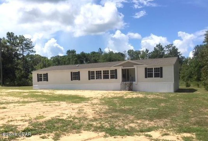 NOT a Short Sale, NOT a bank owned property. Can Close IMMEDIATELY!!! Beautiful move in ready 5 bedroom, 3 bath mobile home on an ACRE OF LAND! This HUGE HOME features over 3300 square feet of living space, spacious floor plan, cozy fireplace in living room, mix of new vinyl flooring and brand-new carpet throughout. Large kitchen with plenty of spaces for storage and new appliances. Also enjoy new HVAC system and even a brand NEW ROOF!... the list just goes on. Centrally located just off of FL-79 and Jackson Comm Rd. easy access to schools, shopping, dining, entertainments and more!!