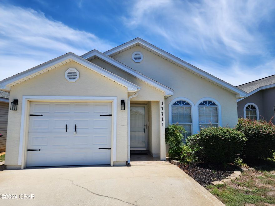 Palm Cove - Open floor plan this 2 bedroom, 2 bath home features split bedroom floor plan, large living/dining combo, tile and laminate flooring throughout, fenced back yard and 1 car garage. Enjoy quiet evenings in your screen enclosed back patio. HOA provides trash, lawn service and community pool. Home is located gated community off Hutchison Blvd. 1 small dog under 20 lbs. $250 pet deposit/$50 pet fee/$50 month pet rent.