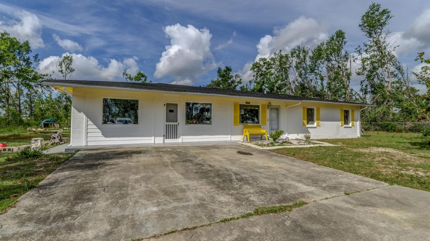 Concrete block home on an acre!  Just painted and ready to move in! Recent renovations on the inside  include hardwood look tile, barn doors to maximize space, large laundry room,  open living room and kitchen with stainless appliances.    The roof is about 4 years old, new tankless water heater, rear shed, new 16 seer ac!  This home is a  must see and won't last long. Centrally located and an easy walk to Deer Point Lake and quick drive into Panama City!  Call today to schedule your own private showing appt.