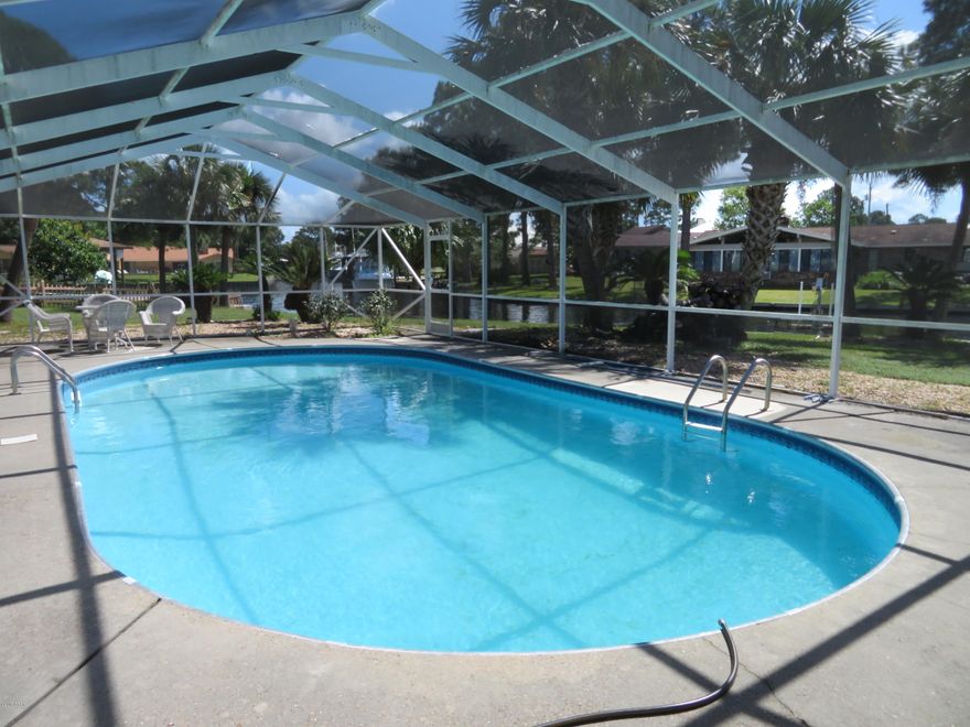 Water lover's delight!  This home has it all. It is located on a navigable canal in Northshore with a boat dock and a lift with gorgeous water views.  Enjoy a scenic ride from home into Goose Bayou, North Bay and then on to the Gulf of Mexico for fun fishing or relaxing on Shell Island.  The home also has an in-ground, screened in pool for the family to enjoy.  It is a spacious home with lots of room to entertain.  The split plan offers a master bedroom suite on one end with a private office/nursery and a bathroom with a whirlpool tub and separate shower.  A guest bedroom and bathroom are on this same end and then 2 more bedrooms and a shared bathroom are on the opposite end of the house.  There is a great room with a fireplace, separate living room and dining room plus a breakfast nook. A Florida room overlooks the water to enjoy the peaceful view.  The home is nicely landscaped and has a roof that is only about 2 years old.  With a little cosmetic updating this could be a true dream home!  It was recently appraised and priced to sell!!  Take a look at the photos but you will want to make an appointment to see this one in person.