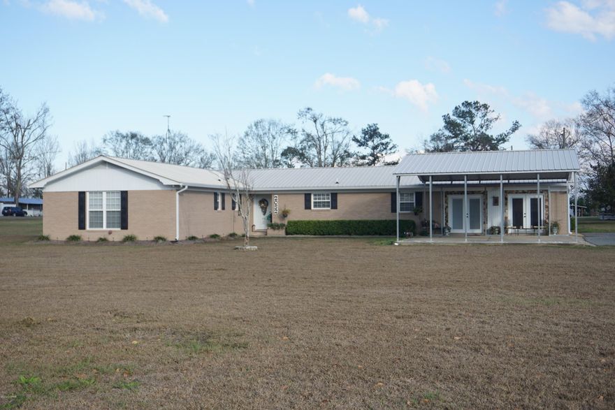 UNDER CONTRACT; SELLER ACCEPTING BACK UP OFFERS Immaculately kept family home. This property is an entire 2.54 acre city block w/ the house featuring 4 bedrooms, 2.5 baths, an open floor plan w/ kitchen, living, dining, & a large family room. It is nicely painted in neutral tones w/ a classic black & white kitchen w/ added pantry storage.  You'll love the large laundry room/ half bath combination just off from the kitchen. All of the floors are in great condition- beautifully done w/ ceramic tile in the kitchen & dining, hardwood in the bedroom wing, & carpet in the den. An extra large storage closet can hold of your extra stuff. Outside you will love the saltwater pool w/ only 3 year old pool liner surrounded by a privacy fenced backyard, & also a 36 X 36 pole barn for your outdoor toys The property is only 1.5 miles away from beautiful Sneads Park & Lake Seminole, a boater or  fisherman's paradise.