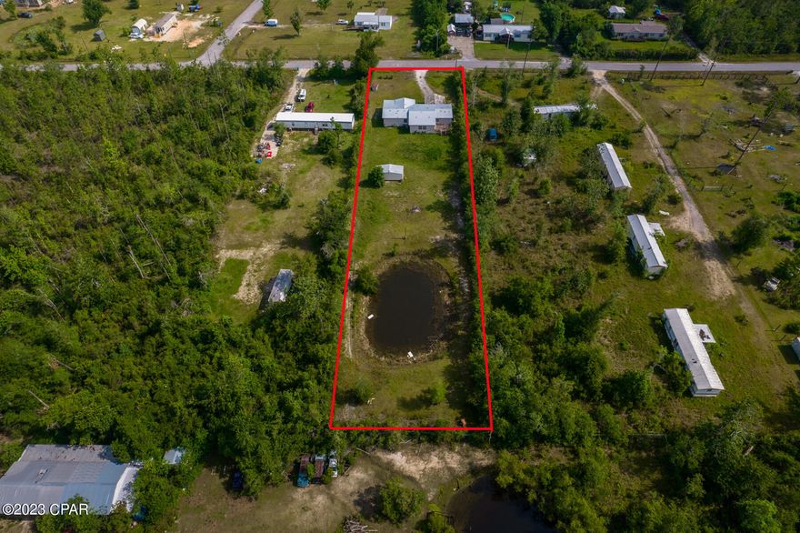 INVESTORS! FLIPPERS! Zoned R2 for Duplex, Single Family Home, Mobile, manufactured or Modular. Welcome to 7620 Blueberry Road, a triple wide mobile home situated on a one-acre lot with pond in the desirable Panama City, Florida. While this property requires repairs, its incredible potential and location make it an excellent opportunity for those seeking a project or investment. The interior of the mobile home offers a canvas awaiting your personal touch you can customize to suit your preferences. The location is another notable feature of this property.  Enjoy easy access to a range of amenities and attractions like the beautiful beaches of the Gulf Coast. Don't miss the opportunity to transform this mobile home into your ideal haven in paradise. Embrace the possibilities and make this property your own! 

Well and Septic in Place!