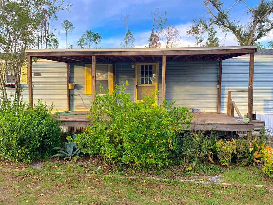 Currently under contract, Seller accepting backup offers!  Looking for a country property that sits on two large lots! This spacious single wide has an open floor concept with a 15x12 addition and opens up to a large back yard. Front and back covered lean-to porches. Outback patio is screened in. Brand new Shingle roof installed in May. Check out Blue springs recreation where Kayaks and paddleboats are welcomed.