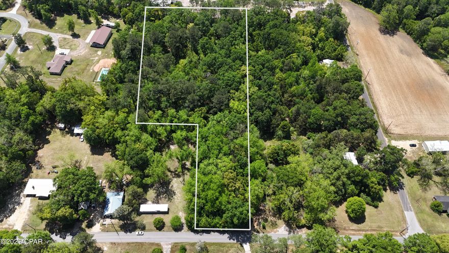 This beautiful  (+/-) 3 acre parcel is nestled on a quiet, paved city street in the heart of Bonifay, Florida--offering the perfect blend of small-town charm and everyday convenience. Located in a peaceful, established neighborhood, the lot gives you room to breathe while still being just minutes from local shops, dining, schools, and essential services.
Whether you're dreaming of building your own private homestead with space for gardens and a custom home, or you're looking for a smart business investment with excellent visibility and access, this versatile property has incredible potential. The gentle terrain and generous size open up all kinds of possibilities for your vision.
Best of all, you're only about 50 minutes from Panama City Beach--home to those world-famous sugar-white sands and emerald waters. Enjoy the best of both worlds: serene country living with easy access to the coast, outdoor adventures, and vibrant beach life. A rare opportunity to own a sizable lot in town with so much upside. Don't miss your chance to make this peaceful slice of Florida yours!

Full price offer seller will pay for survey!!
