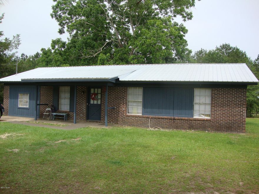 4 Bedroom 1.5 Bath Brick house on large lot at the edge of town. Garage has been turned into the 4th bedroom or could be used as a den. Nice size living room. Eat in kitchen with plenty of room and doors leading outside to a patio. Nice mature pecan tree in the backyard. Frontage on paved road. Concrete walkway. Convenient to shopping, schools and churches. Move in ready!