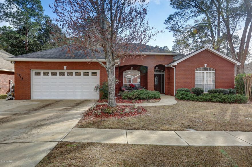 Wonderful all brick 4 bedroom, 3 bath home on quiet, family friendly street in the heart of Lynn Haven.  Featured in the 2004 Parade of Homes.  The home features many upgrades including crown molding, arched doorways, high ceilings, hardwood floors, surround sound.  The eat in kitchen includes granite counter tops, stainless steel appliances including a warming drawer, and custom cabinets and hood.  The kitchen is open to the living and dining area which features hardwood floors, gas fireplace, custom built in shelving.  The master bedroom has attached master bath with double marble vanities, large jetted tub, separate shower and water closet.  The large walk in closet is conveniently attached to master bath and laundry room. The split floor plan has 3 bedrooms and 2 baths opposite the master bedroom. The largest additional bedroom could be a 2nd master as it includes an attached bath and walk in closet.  Off the kitchen is a screened in porch and fenced backyard.  Sydney Lane features sidewalks, underground utilities and is a short golf cart drive to Panama Country Club.  Please make your appointment to see this great home today.