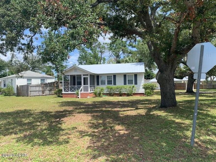 Fantastic Florida cottage located in the historic district of St. Andrews.  Just a short walk to Lake Huntington and St. Andrews Bay.  Also very close to Downtown St. Andrews with several restaurants, coffee shops, and shopping.  This cottage features sits on a corner lot with large shade tree oaks, original hardwood floors, den, screened in front porch, and detached covered carport with storage.