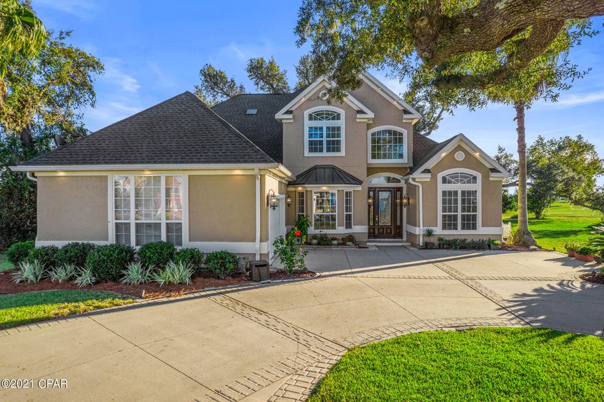 CURRENTLY UNDER CONTRACT, SELLER ACCEPTING BACKUP OFFERS!! A beautiful move-in ready home nestled in Lynn Haven's desired Panama Country Club neighborhood is now available! It features incredible views of our beautiful Florida sunrises through the front door, upstairs rooms, and kitchen dining area. The property also has excellent lighting throughout. The house features an open concept design with views overlooking the golf course.  The kitchen has granite countertops, plenty of cabinet space, a gas stovetop, pantry, & a large breakfast bar.  The family room includes a corner fireplace and a closed-in heated outside patio, not included in the house's square footage. This 5BR/4.5BA home has a new roof, two new A/C units, new appliances upgraded to WOLF brand, all new recessed LED lights, new outdoor and indoor light fixtures, new ceiling fans, and new kitchen solar window shades. The Master bedroom is on the first floor, with a new vanity and cabinets in the master bathroom. The exterior stucco, including doors, baseboards, and trim, are all newly painted. The second floor includes an additional living room area that can be used as a game room or an extra office. It also includes three bedrooms and an outside patio that overlooks the golf course and a beautiful lake.  You need to visit this stunning home in person! The Panama City Country Club community is a quiet and family-friendly neighborhood with an 18-hole course and clubhouse.  The location is convenient and accessible to everything! Homes of this caliber don't come on the market often, so you won't want to miss out! The sellers are also open to negotiating on some of the furniture in the home.  This home shows beautifully and is ready for new owners to settle in. Contact Ayesha Albibi today to schedule a private viewing.